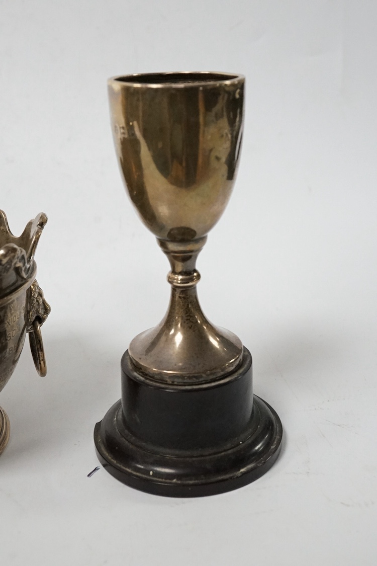 A late Victorian silver miniature presentation two handled 'Monteith' bowl, with engraved inscription, Wakely & Wheeler, London, 1900, height 73mm, together with two later silver presentation trophy cups, 12.8oz. Conditi